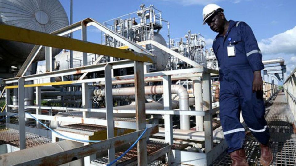 A worker walks by an oil well at the Toma South oil field to Heglig, in Ruweng State, South Sudan 