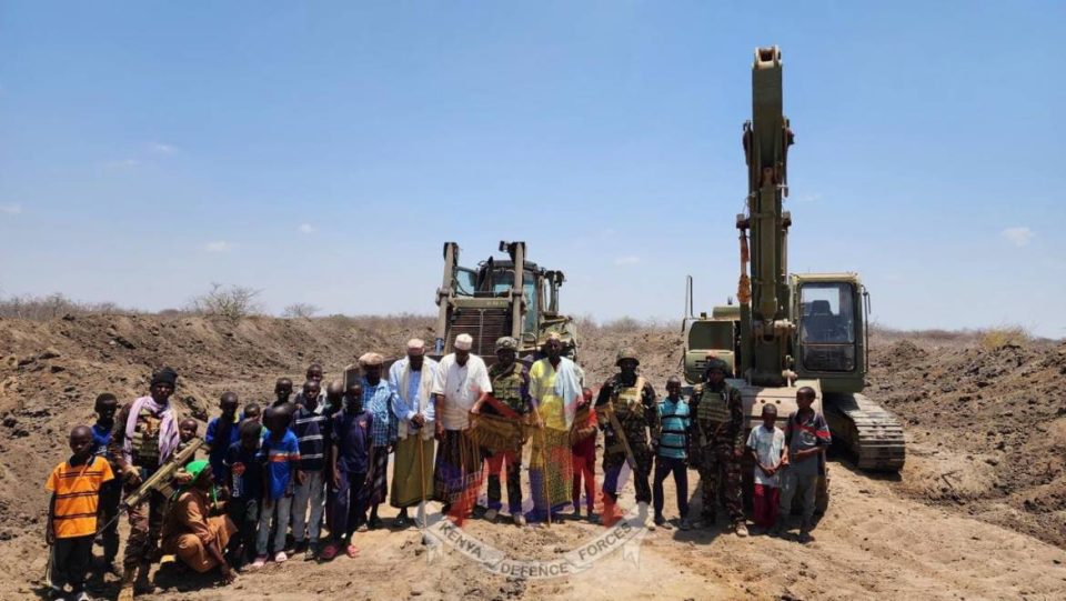 KDF soldiers stand alongside Sarira village residents, marking the successful completion of a community water pan project aimed at alleviating water scarcity. Photo Courtesy/ KDF